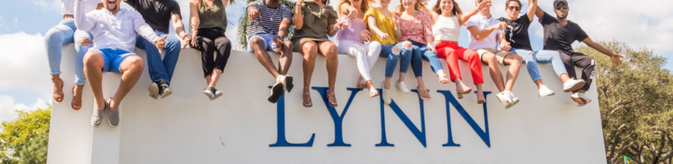 Students on top of Lynn University Sign