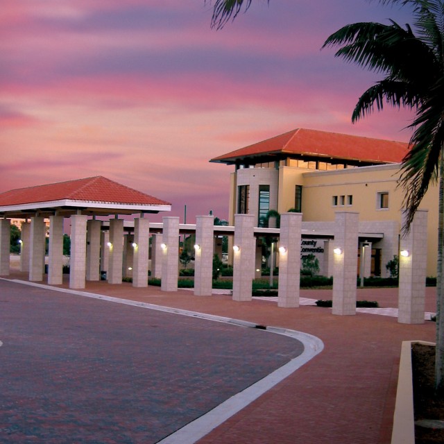 Exterior photo of the front of the building courtyard and Hilton view