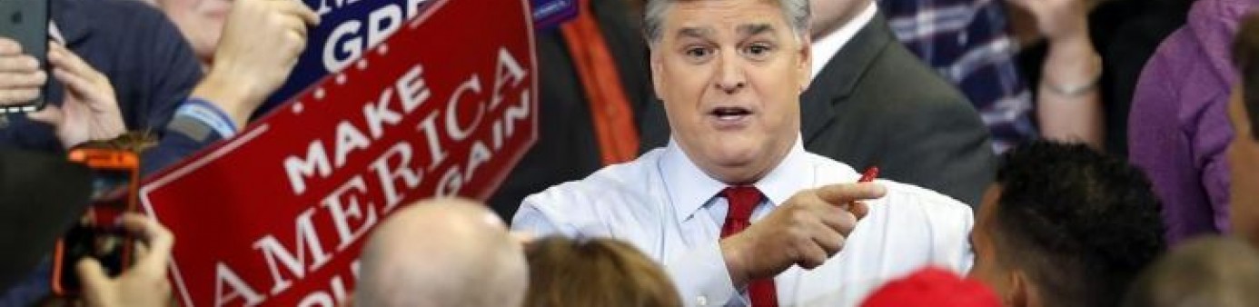 Photo of television personality Sean Hannity speaks to members of the audience while signing autographs before the start of a campaign rally Monday, Nov. 5, 2018, in Cape Girardeau, Mo., with President Donald Trump. AP/Jeff Roberson