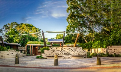 Photo of the ticket hut at zoo entry with a family purchasing tickets
