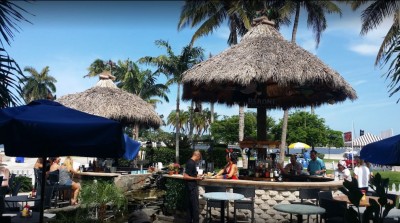 Outside bar area with tiki straw roofs of ER Bradleys